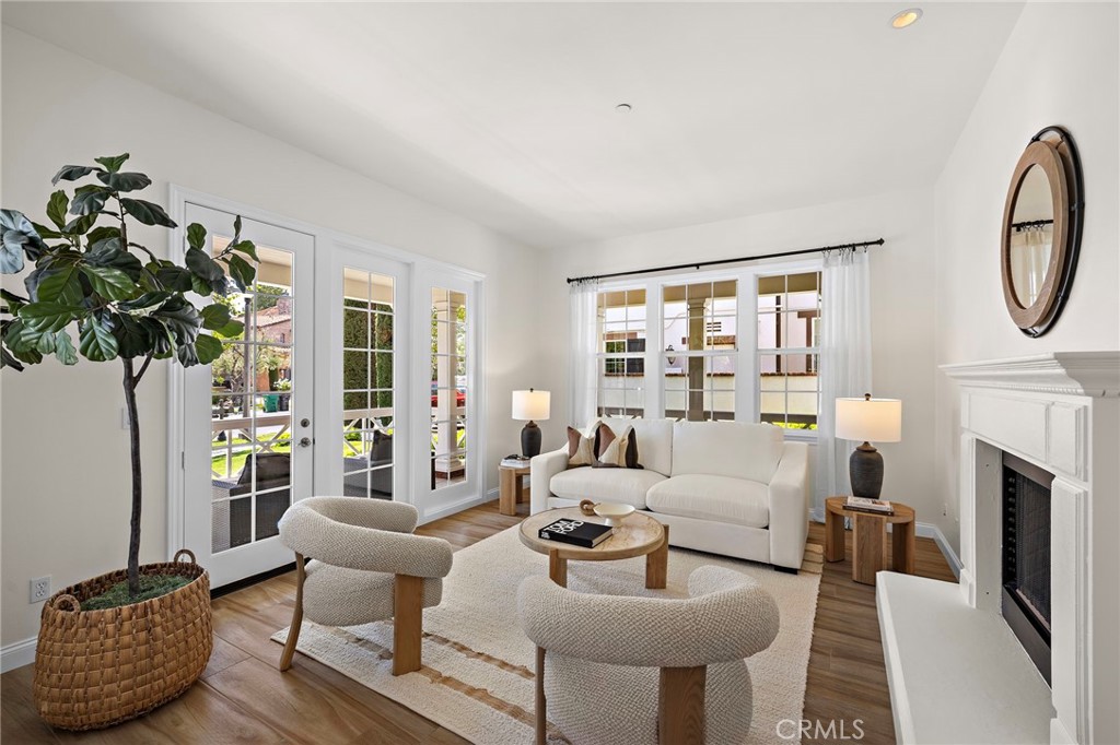 3 Tranquility Place Ladera Ranch, CA 92694 - Photo 6 of 63 a living room with furniture a fireplace and a potted plant