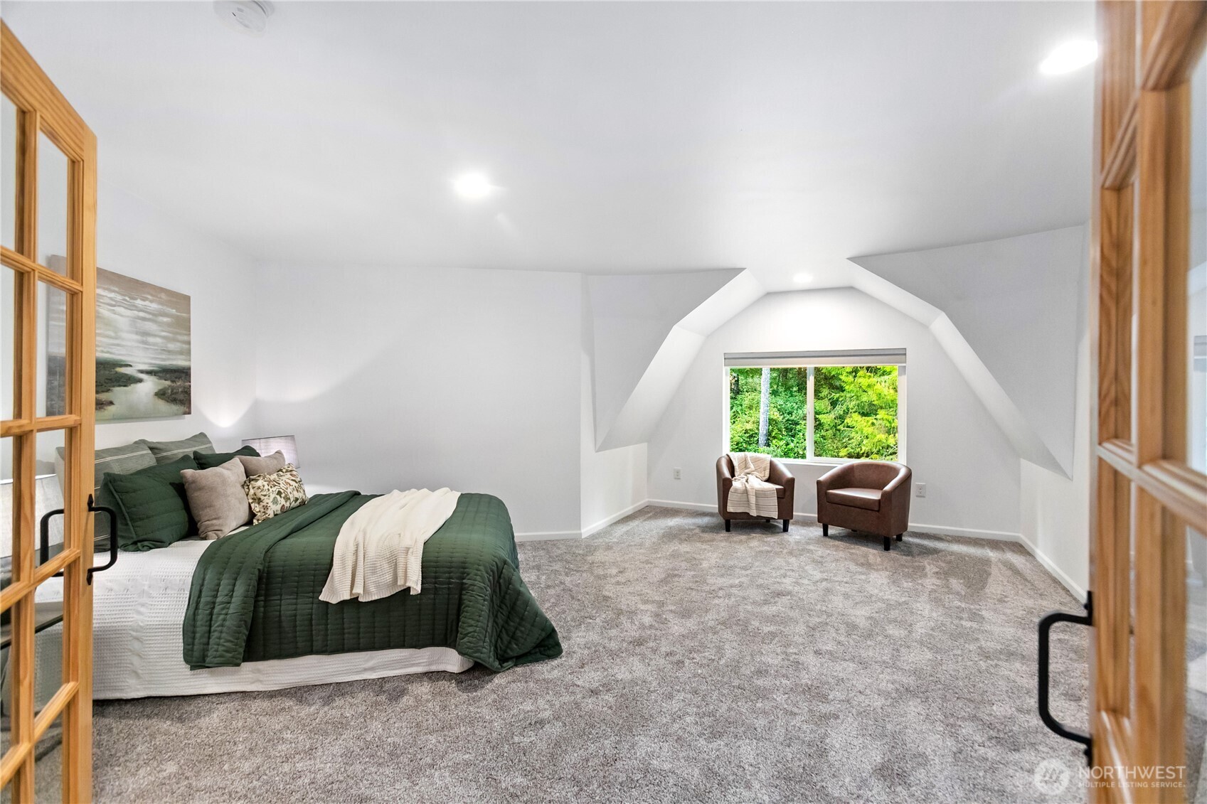 9504 Southwest Caulfield Lane Port Orchard, WA 98367 - Photo 21 of 40 a spacious bedroom with a bed and a large window
