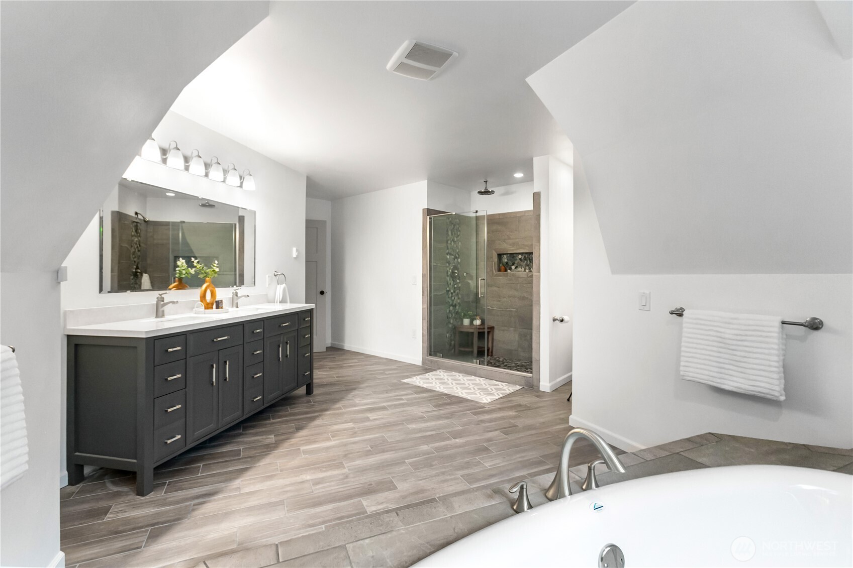 9504 Southwest Caulfield Lane Port Orchard, WA 98367 - Photo 25 of 40 a bathroom with a sink mirror and a shower