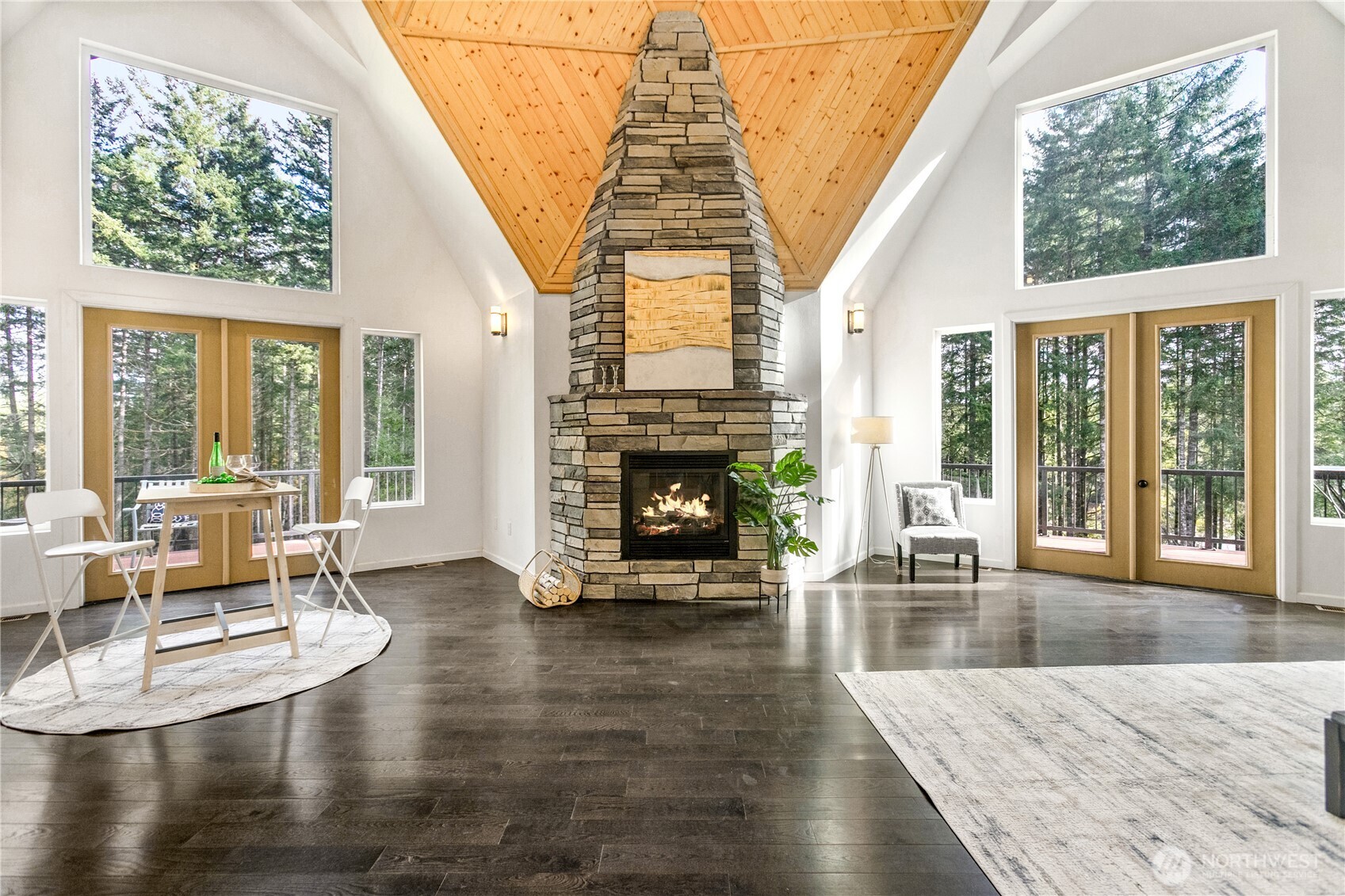 9504 Southwest Caulfield Lane Port Orchard, WA 98367 - Photo 3 of 40 a living room with furniture and a fireplace