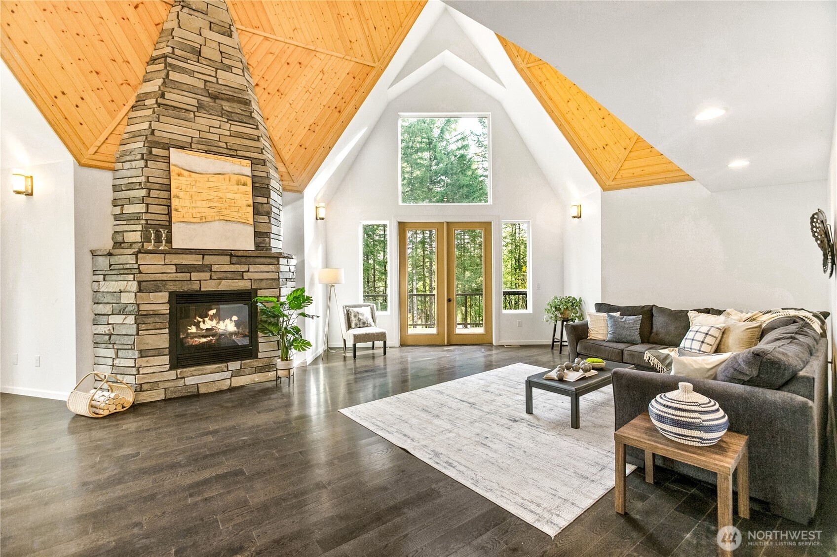9504 Southwest Caulfield Lane Port Orchard, WA 98367 - Photo 4 of 40 a living room with furniture a fireplace and a table