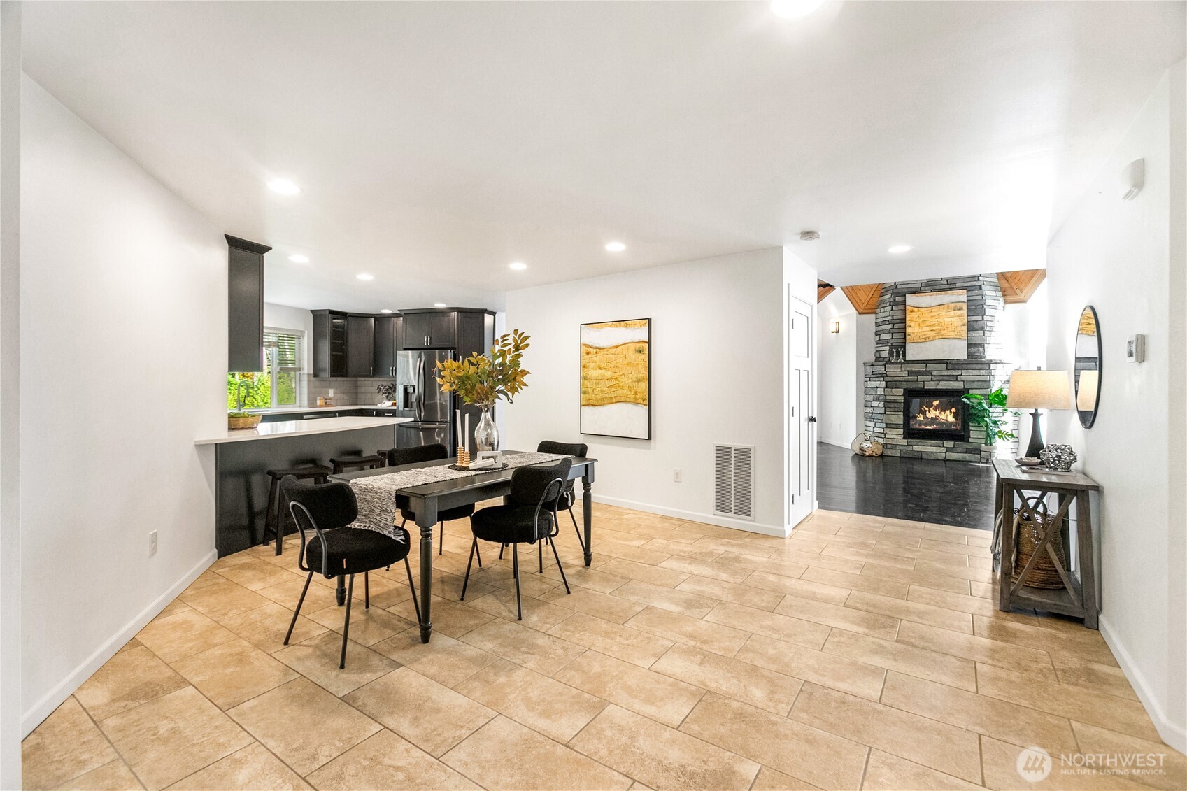 9504 Southwest Caulfield Lane Port Orchard, WA 98367 - Photo 10 of 40 a kitchen with stainless steel appliances kitchen island granite countertop a sink and cabinets