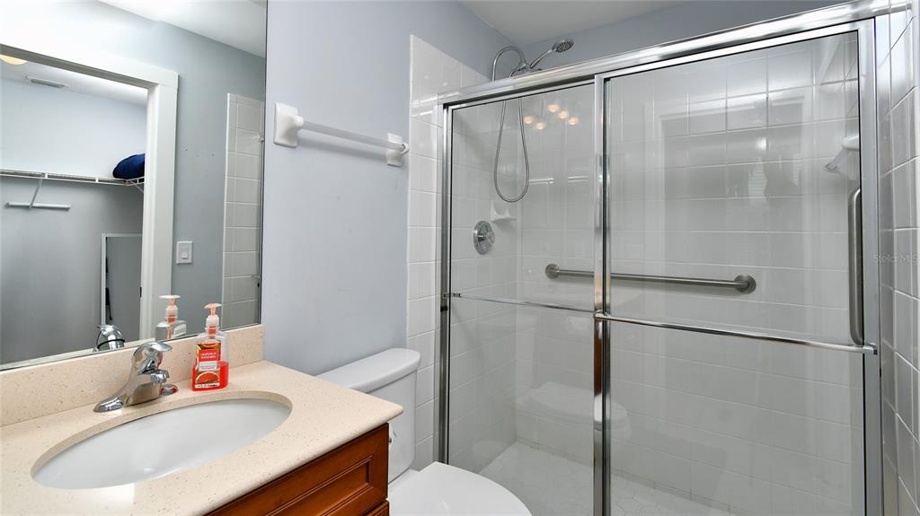 2090 Matecumbe Key Road, Unit 1308 Punta Gorda, FL 33955 - Photo 18 of 29 a bathroom with a sink toilet and shower