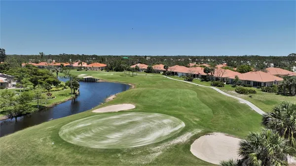 a view of a lake with a yard
