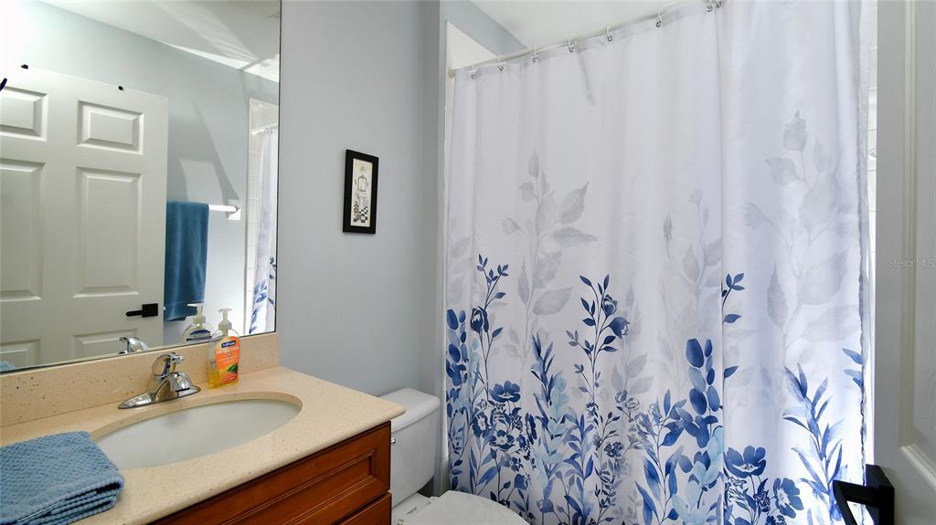 2090 Matecumbe Key Road, Unit 1308 Punta Gorda, FL 33955 - Photo 10 of 29 a bathroom with a sink and a mirror