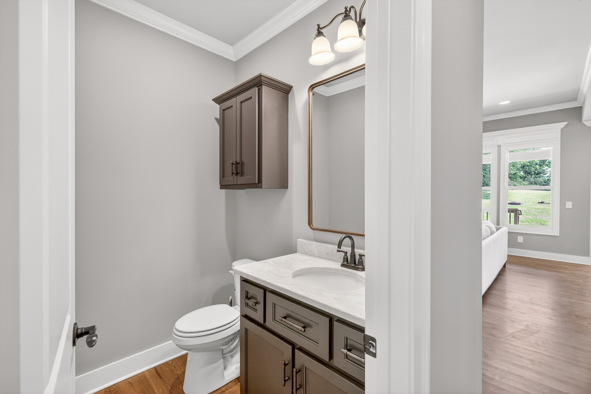1176 Iron Bridge Road Columbia, TN 38401 - Photo 22 of 53 a bathroom with a toilet sink and mirror