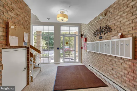 a view of entryway with furniture and garden