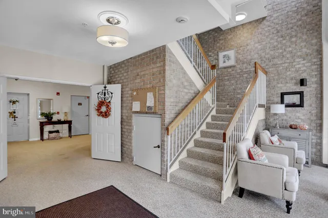 a view of livingroom with furniture and stairs