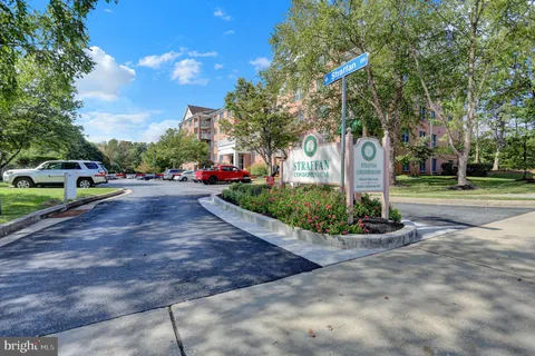 a view of a park with swings and slides