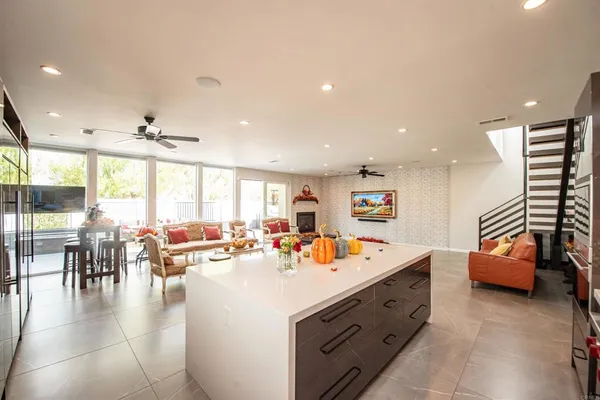 a very nice looking living room with furniture and a large window