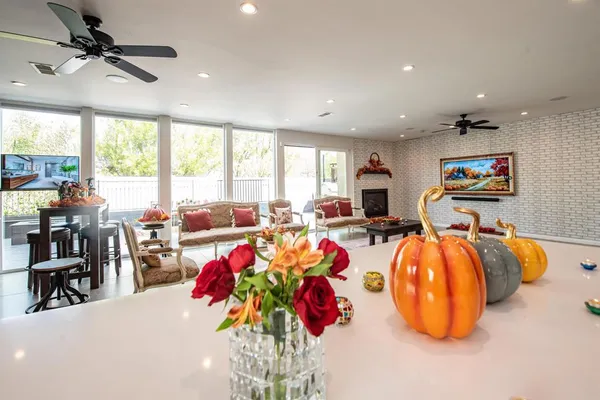 a living room with lots of furniture and a chandelier