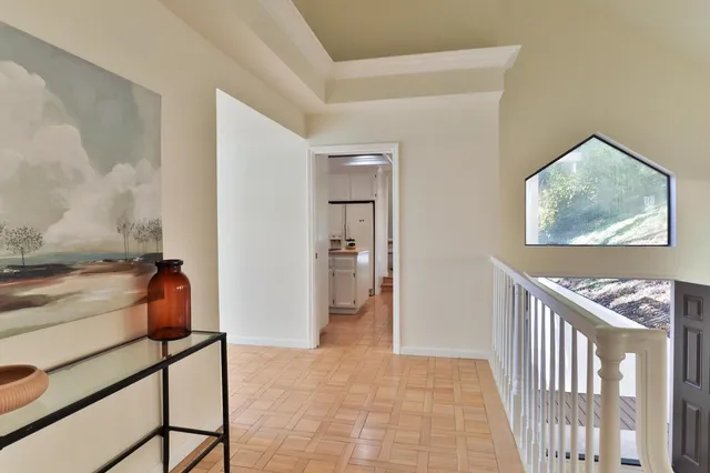 a view of a dining room with furniture wooden floor and chandelier
