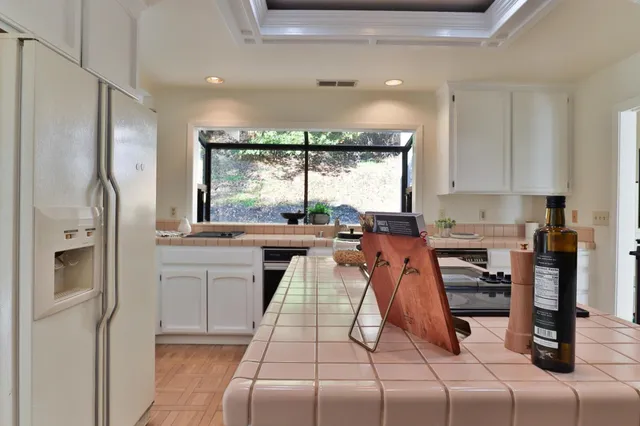 a bed room with a bed and a large window