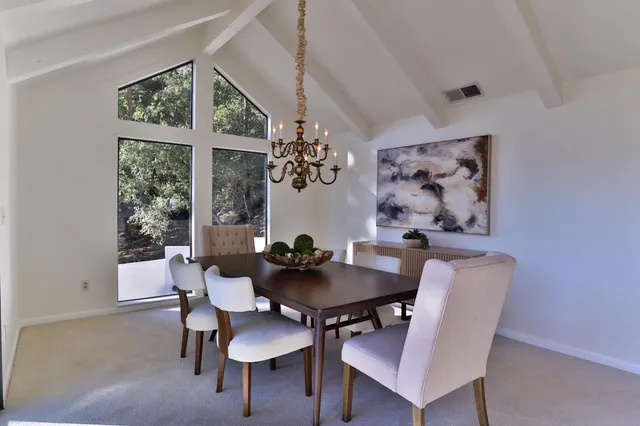 a view of a house with a tree in front of it