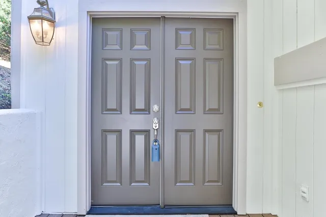 a kitchen with cabinets appliances a sink and a counter top space