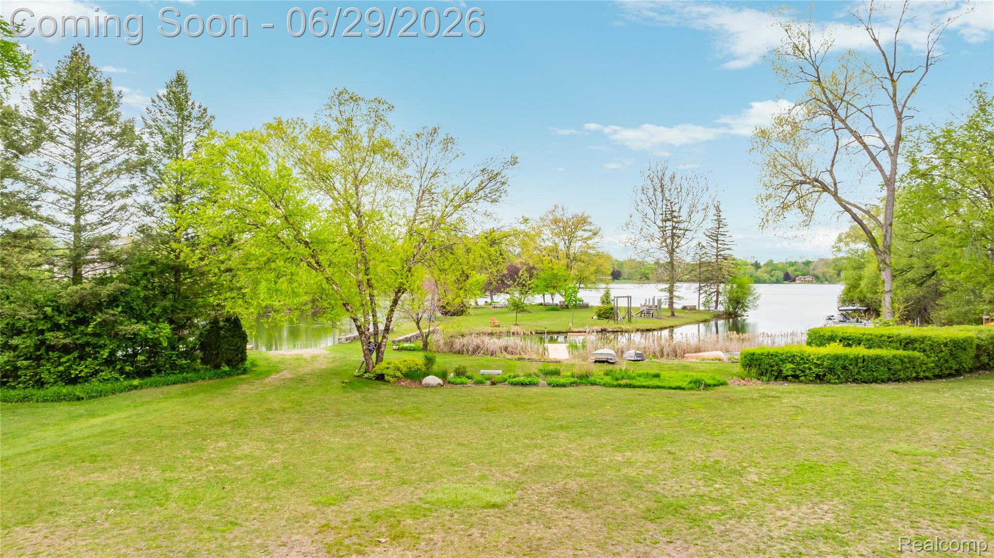 6085 Worlington Road Bloomfield Hills, MI 48301 - Photo 65 of 75 Expansive green lawn with mature trees and sculpted hedges