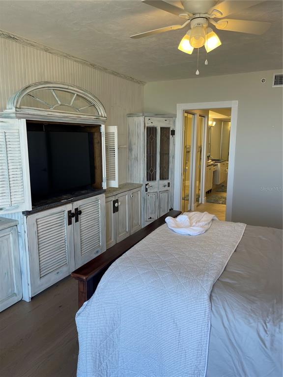 4651 South Atlantic Avenue, Unit 9105 Ponce Inlet, FL 32127 - Photo 12 of 20 a bedroom with a bed and a flat screen tv