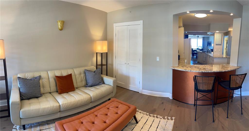 4651 South Atlantic Avenue, Unit 9105 Ponce Inlet, FL 32127 - Photo 15 of 20 a living room with furniture and a dining table