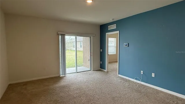 a view of kitchen with stainless steel appliances granite countertop refrigerator sink and stove