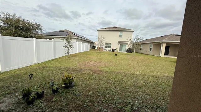 an entrance to house with yard