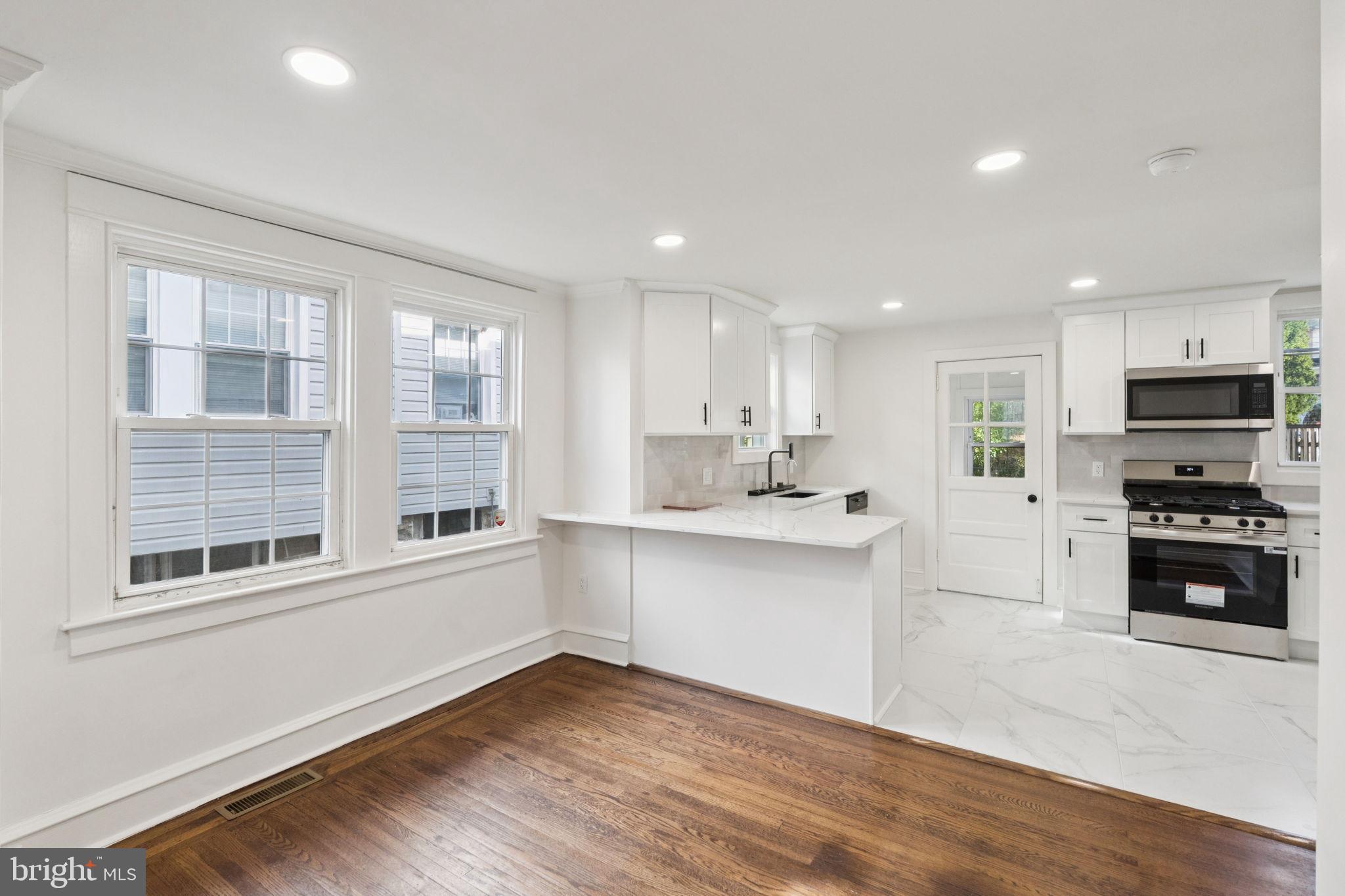 333 Blanchard Road Drexel Hill, PA 19026 - Photo 15 of 45 a kitchen with stainless steel appliances granite countertop a stove a sink and a refrigerator