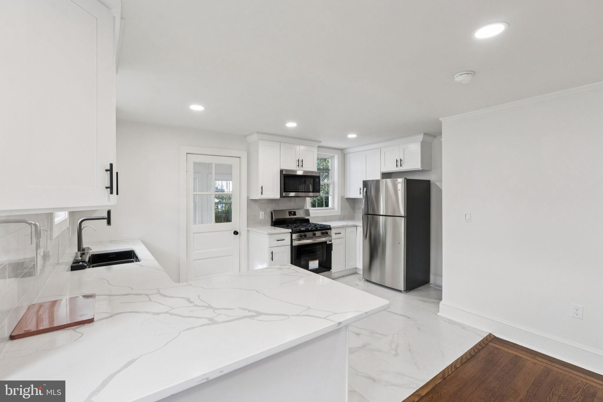 333 Blanchard Road Drexel Hill, PA 19026 - Photo 17 of 45 a kitchen with refrigerator and a sink