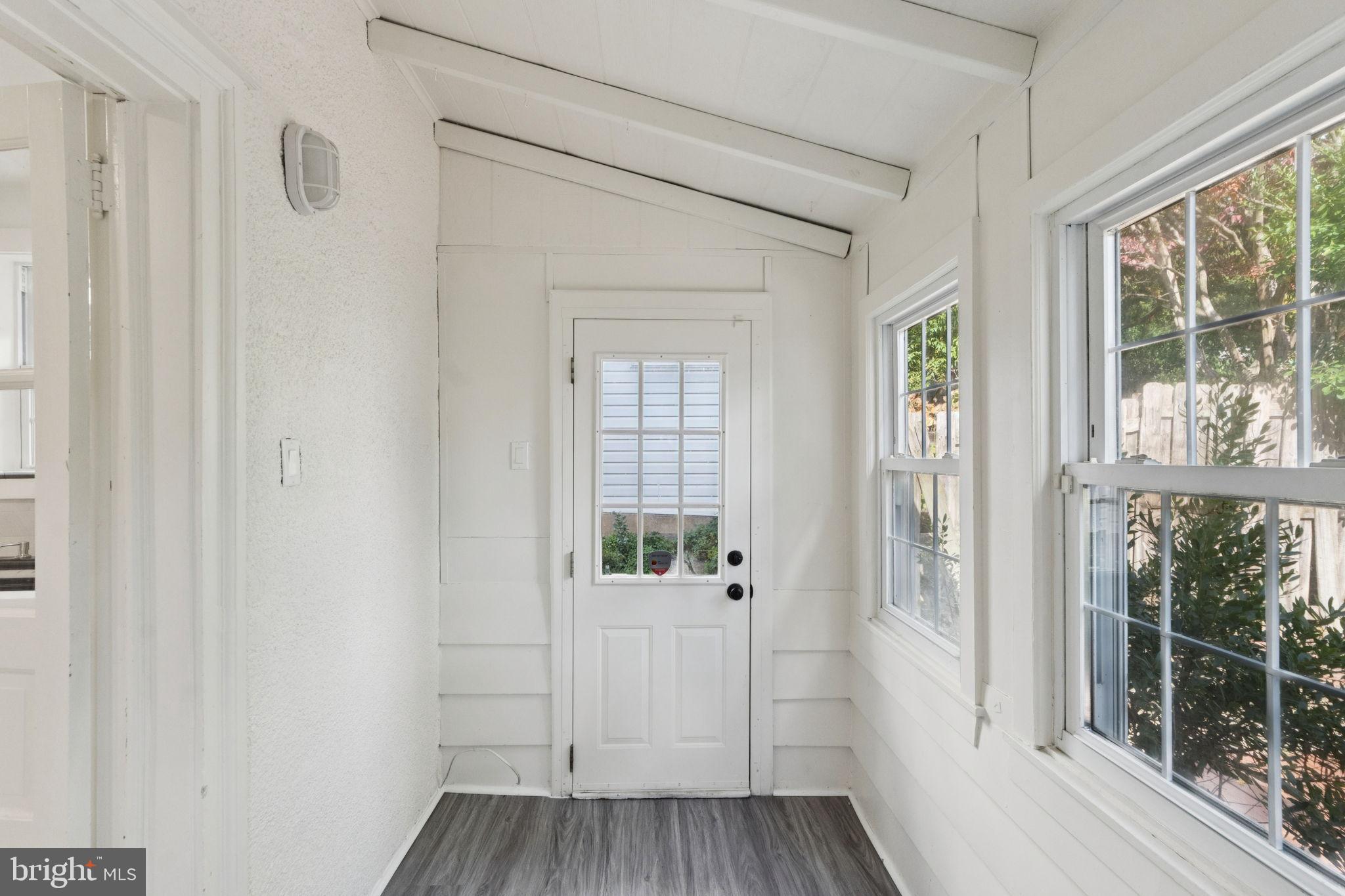 333 Blanchard Road Drexel Hill, PA 19026 - Photo 22 of 45 a view of a hallway with wooden floor and a window