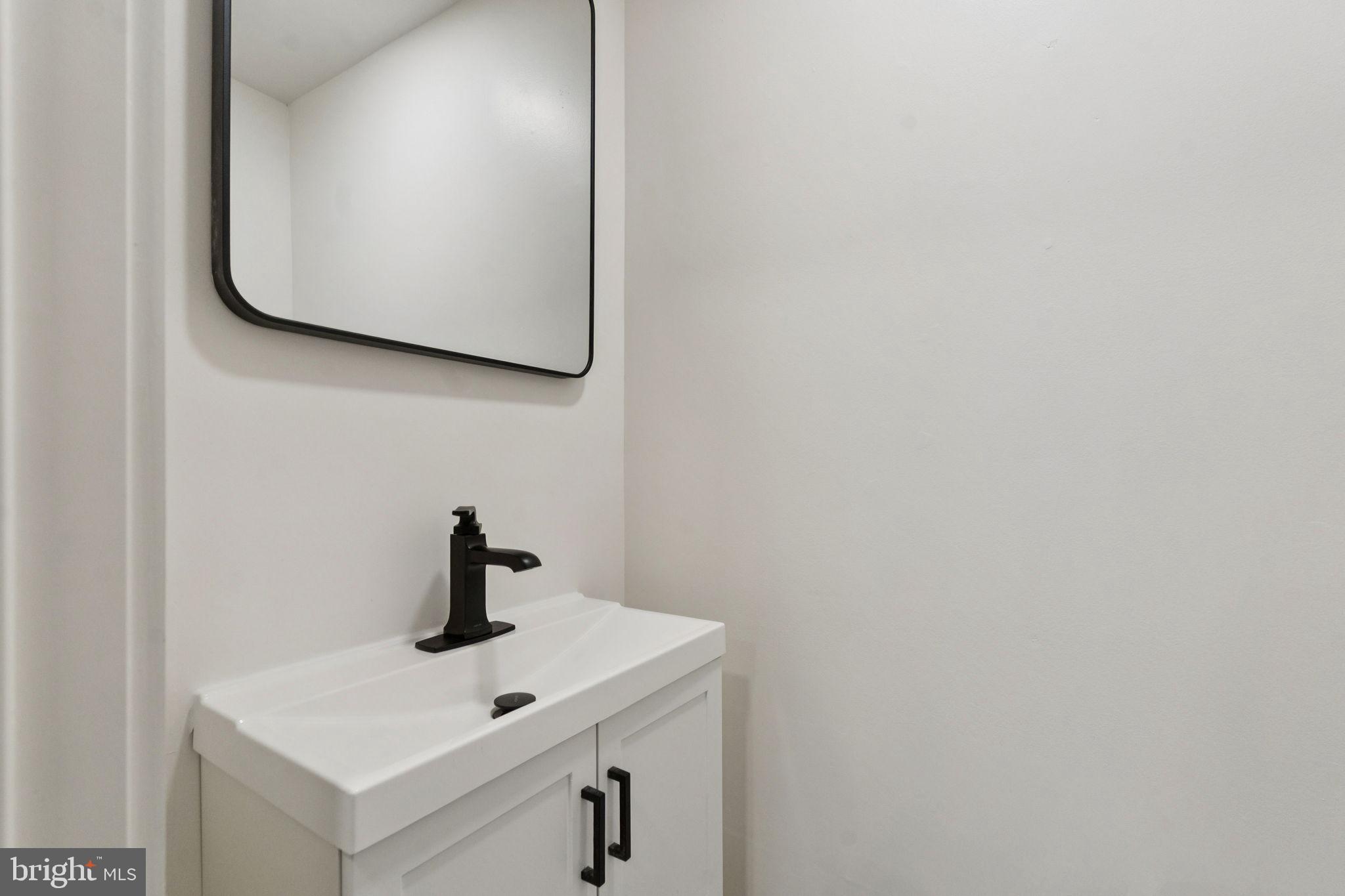 333 Blanchard Road Drexel Hill, PA 19026 - Photo 24 of 45 a bathroom with a sink and mirror