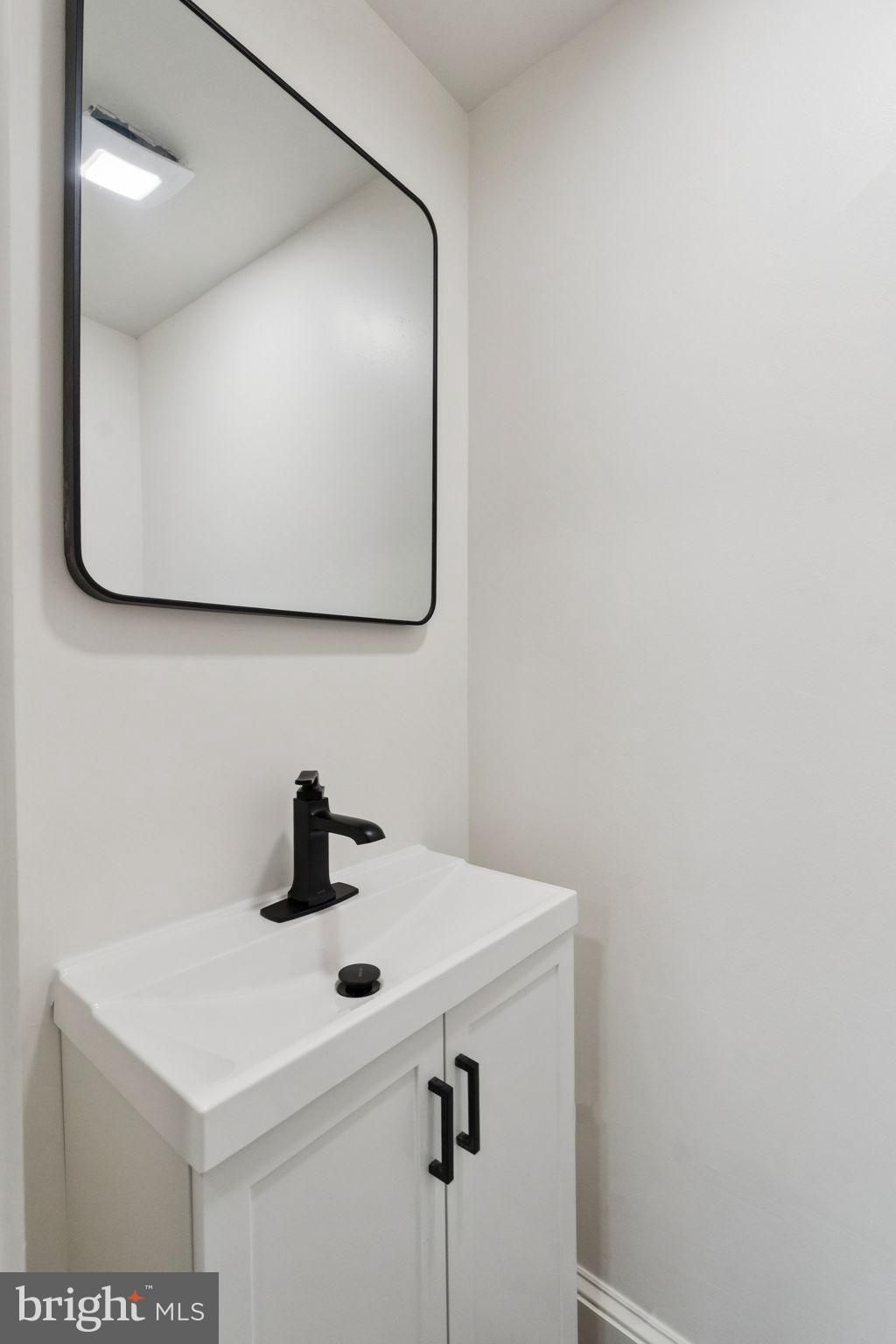 333 Blanchard Road Drexel Hill, PA 19026 - Photo 25 of 45 a bathroom with a sink and mirror