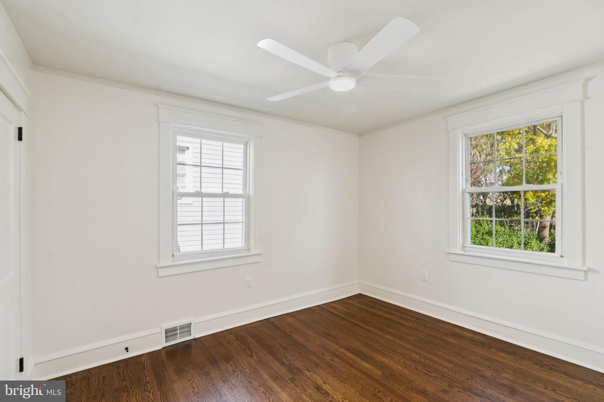 333 Blanchard Road Drexel Hill, PA 19026 - Photo 32 of 45 an empty room with wooden floor and windows