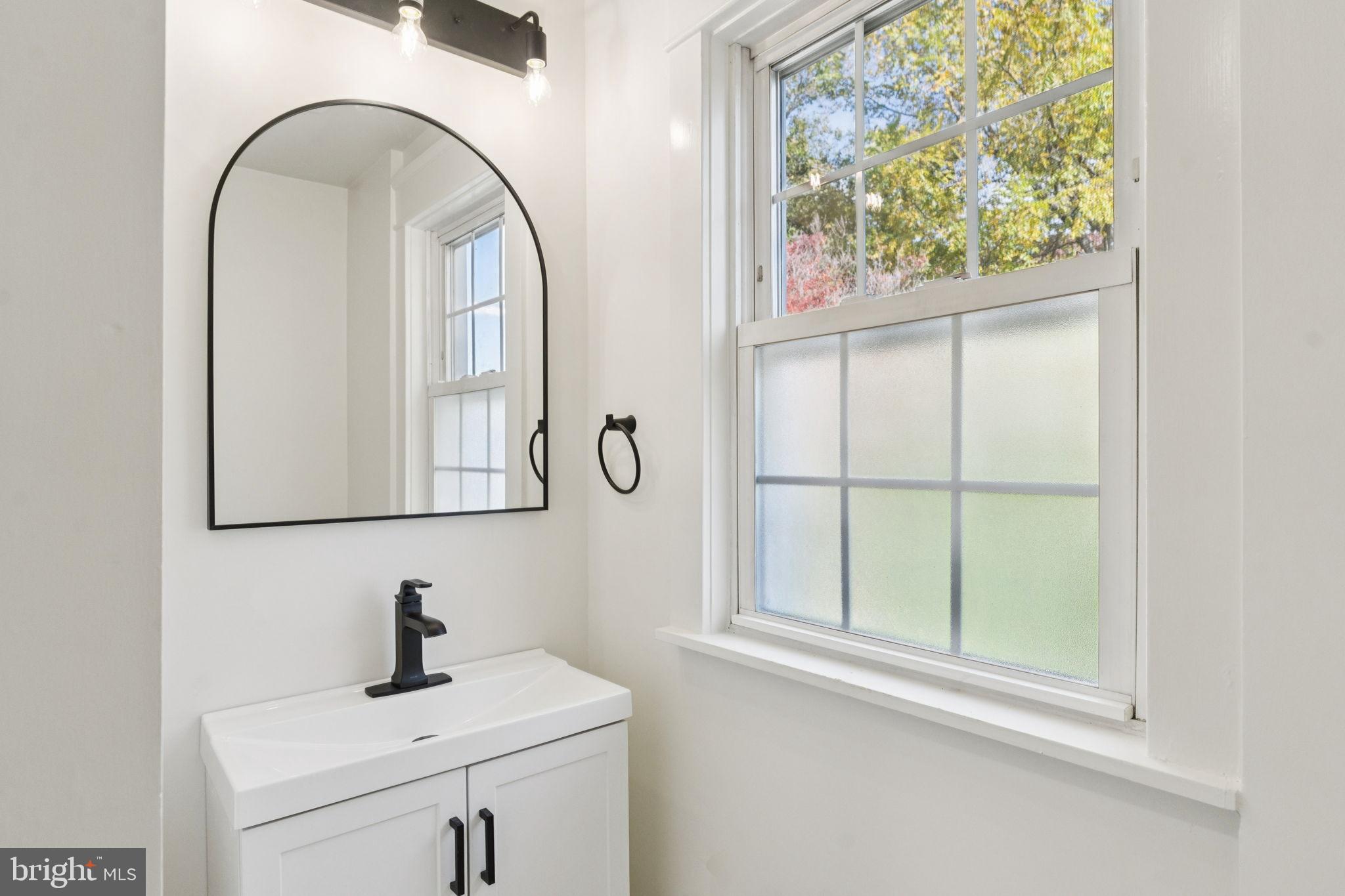 333 Blanchard Road Drexel Hill, PA 19026 - Photo 38 of 45 a bathroom with a sink and a mirror