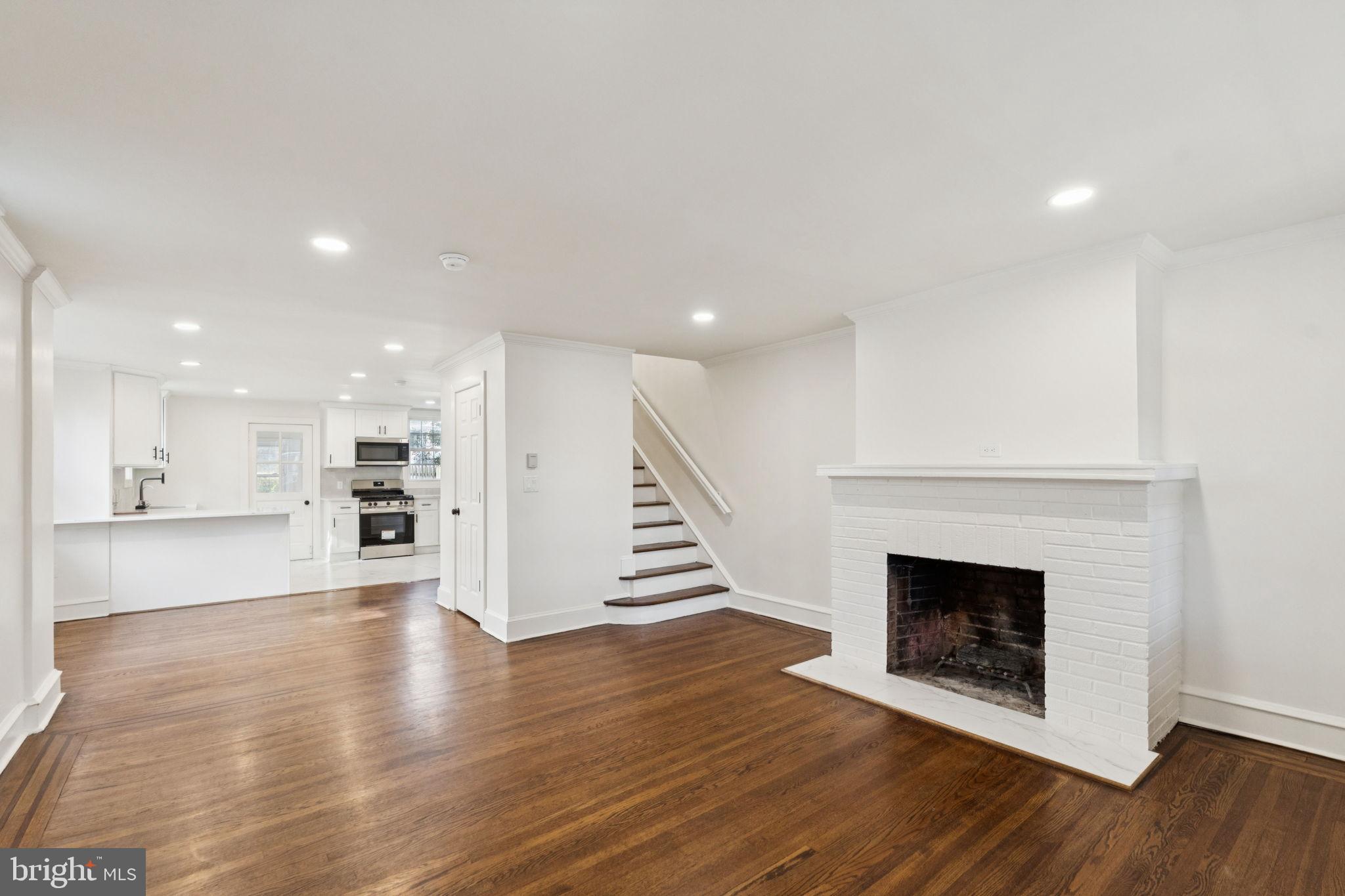 333 Blanchard Road Drexel Hill, PA 19026 - Photo 8 of 45 a view of an empty room with wooden floor fire place