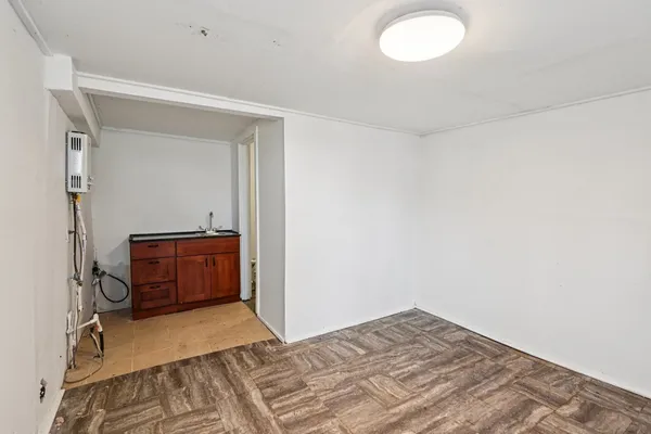 a bedroom with a bed and a view of bathroom