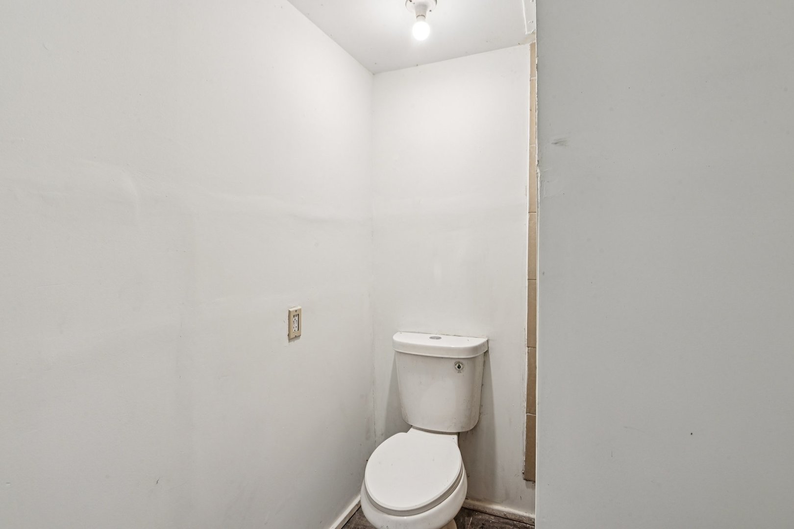 1326 Nippersink Drive Spring Grove, IL 60081 - Photo 7 of 12 a white toilet sitting next to a white wall