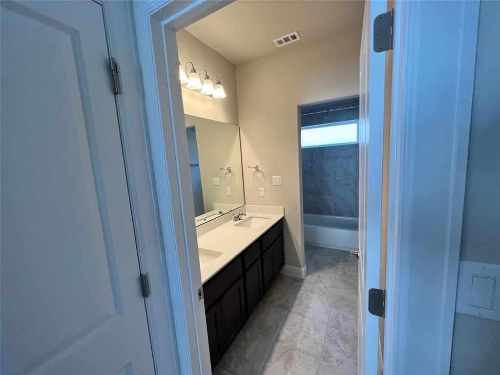128 Free Stone Drive Georgetown, TX 78628 - Photo 17 of 29 Double vanity with undermount sinks and white countertops