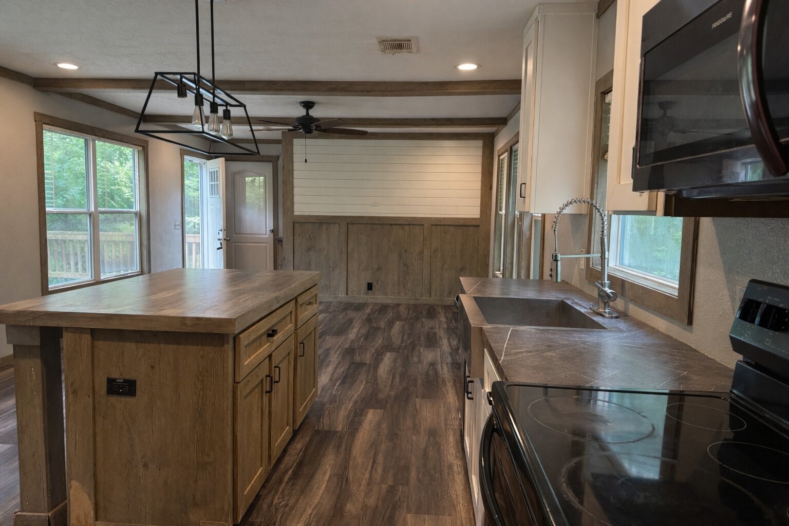 105 Saddle Surrey Road Coldspring, TX 77331 - Photo 37 of 48 a kitchen with stainless steel appliances granite countertop a sink a stove and a refrigerator