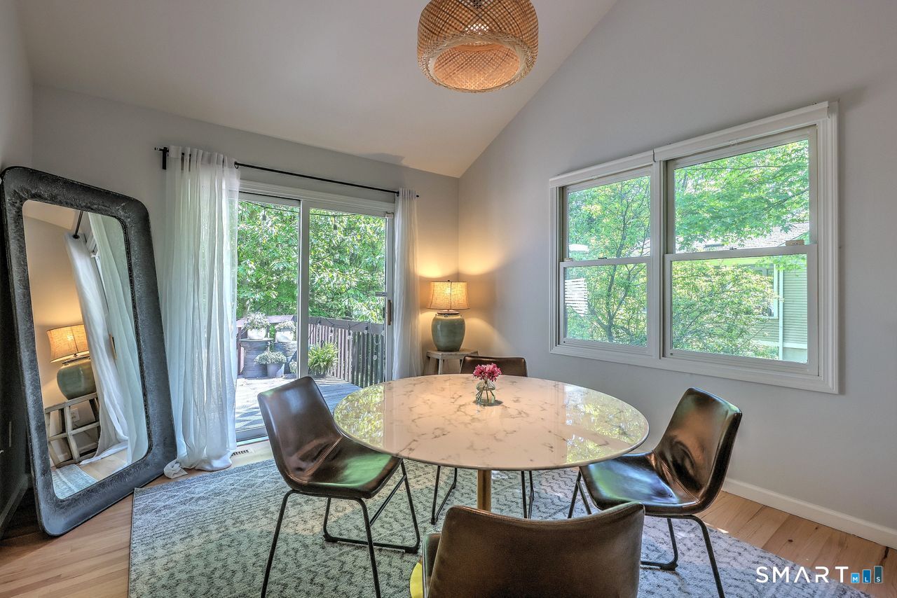 9 Canterbury Road, Unit 9 Hamden, CT 06514 - Photo 12 of 29 a view of a dining room with furniture window and wooden floor