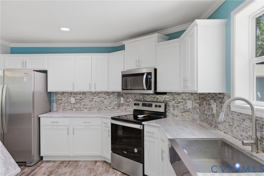 93 Faraway Road Saluda, VA 23149 - Photo 14 of 58 a kitchen with a sink stove and refrigerator