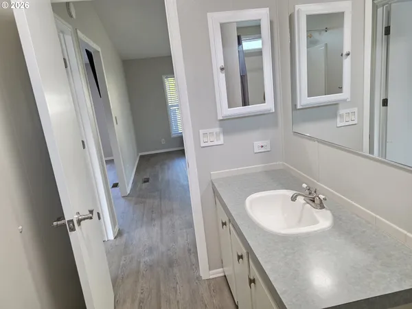 wooden floor and window in an empty room