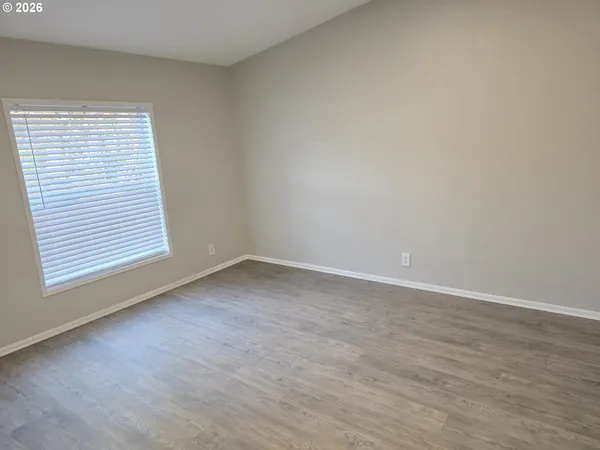 a bathroom with a toilet a sink and a mirror