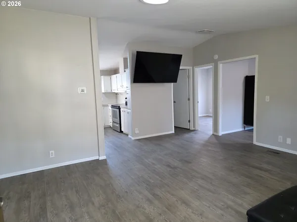 a view of an empty room with a window