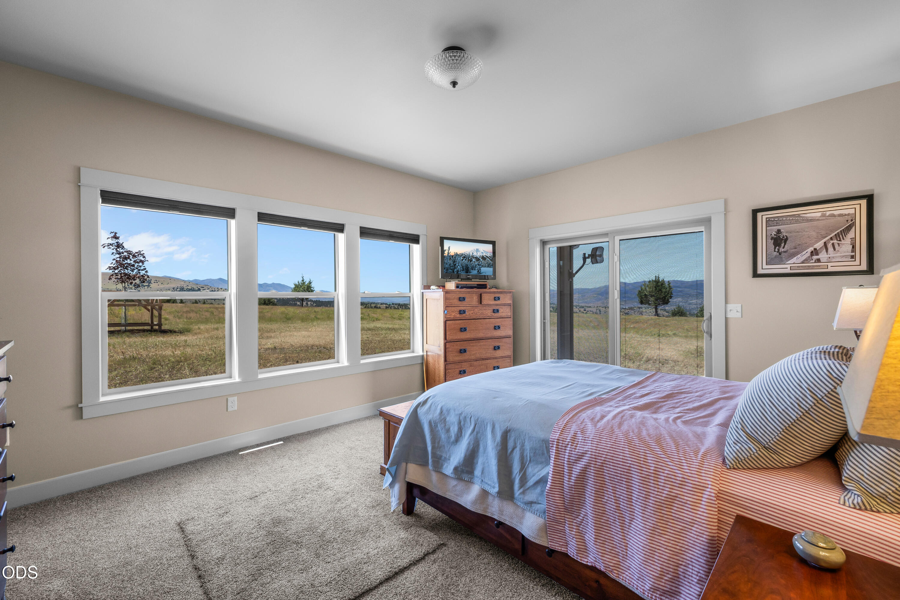 26216 West Bench Road John Day, OR 97845 - Photo 19 of 53 a bedroom with a large bed and a large window