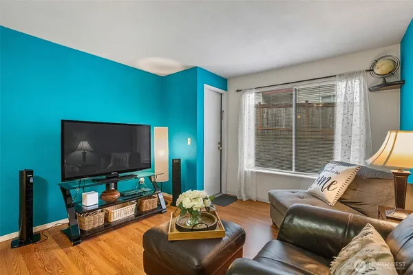 a living room with furniture and a flat screen tv