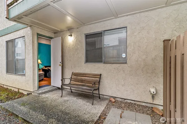 a view of a hallway with wooden floor and entryway