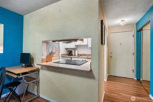 a kitchen with a table and chairs