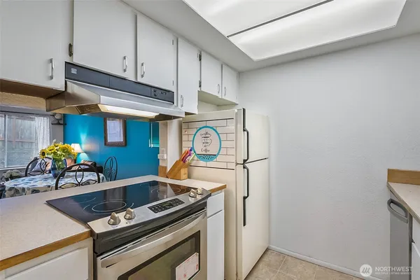 a kitchen with a stove and a sink