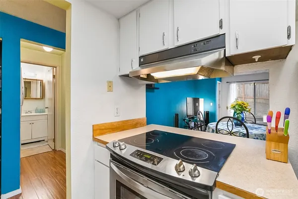 a view of a kitchen with a sink and cabinets