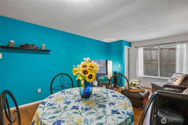 a bedroom with a bed table and chair