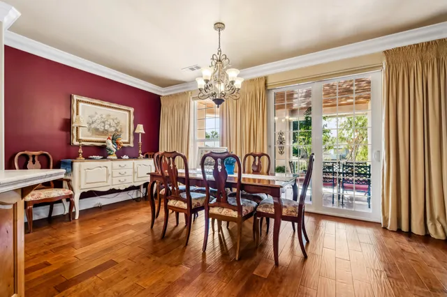 a bed room with a bed and a chandelier