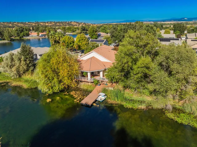 a aerial view of a house with a yard and garden